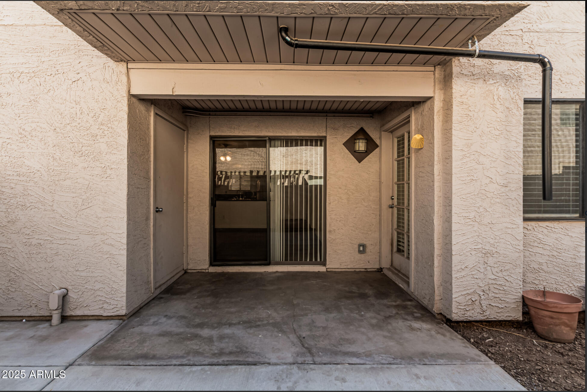 1065 West 1st Street, Unit 102 Tempe, AZ 85281 - Photo 18 of 24 a view of a porch with wooden floor and a glass door