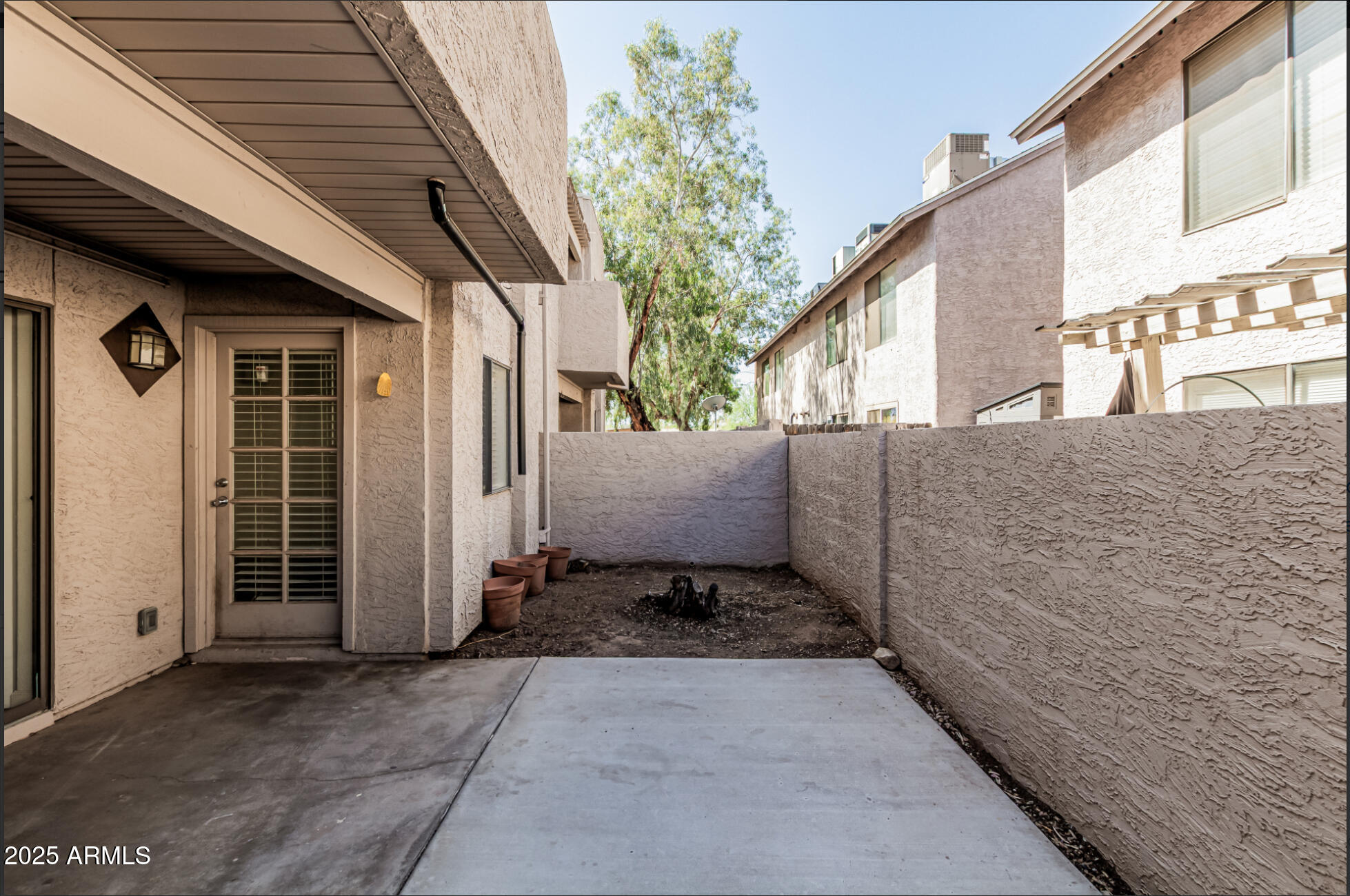 1065 West 1st Street, Unit 102 Tempe, AZ 85281 - Photo 19 of 24 a view of a house with a outdoor space