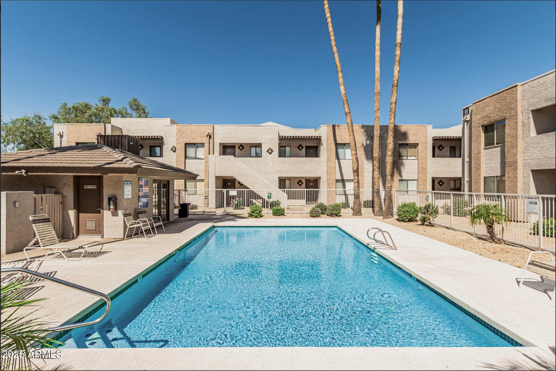 1065 West 1st Street, Unit 102 Tempe, AZ 85281 - Photo 24 of 24 a view of a house with swimming pool and sitting area