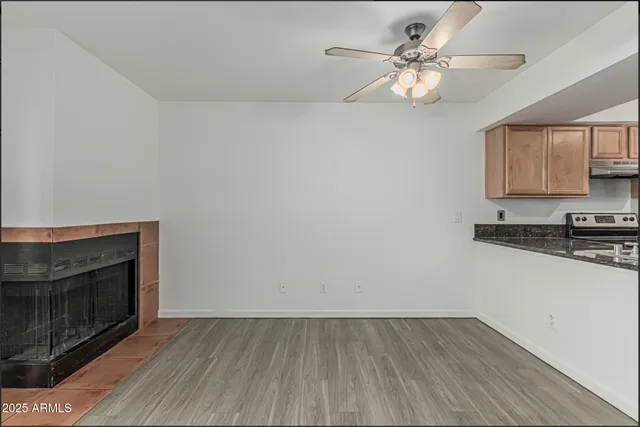 a view of a kitchen with a stove cabinets and wooden floor