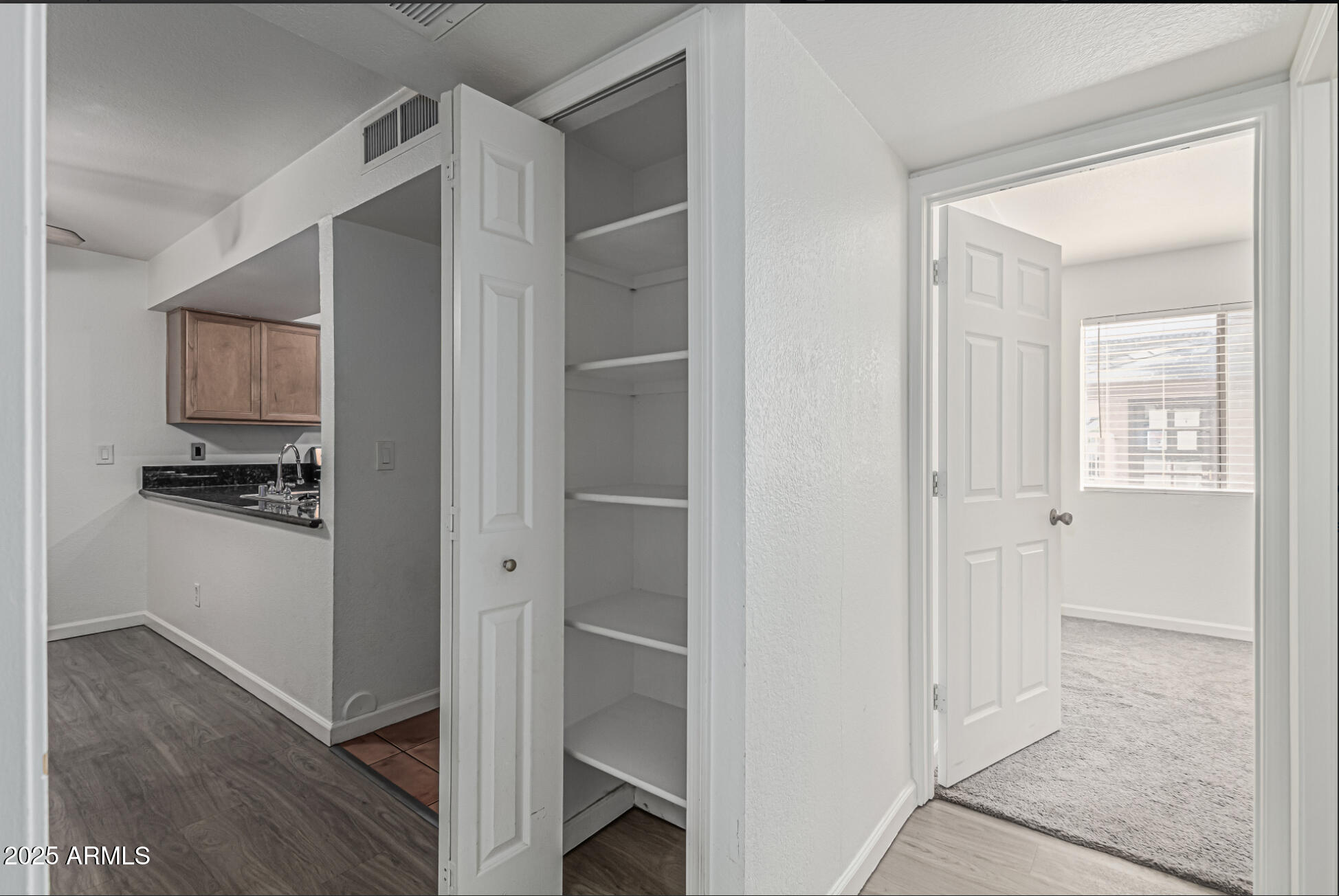 1065 West 1st Street, Unit 102 Tempe, AZ 85281 - Photo 10 of 24 a view of kitchen with wooden floor
