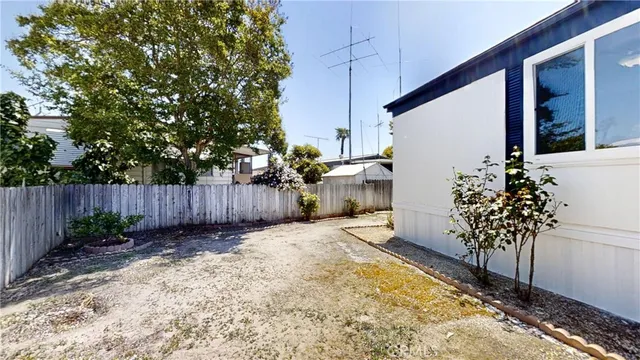 a view of a backyard of the house
