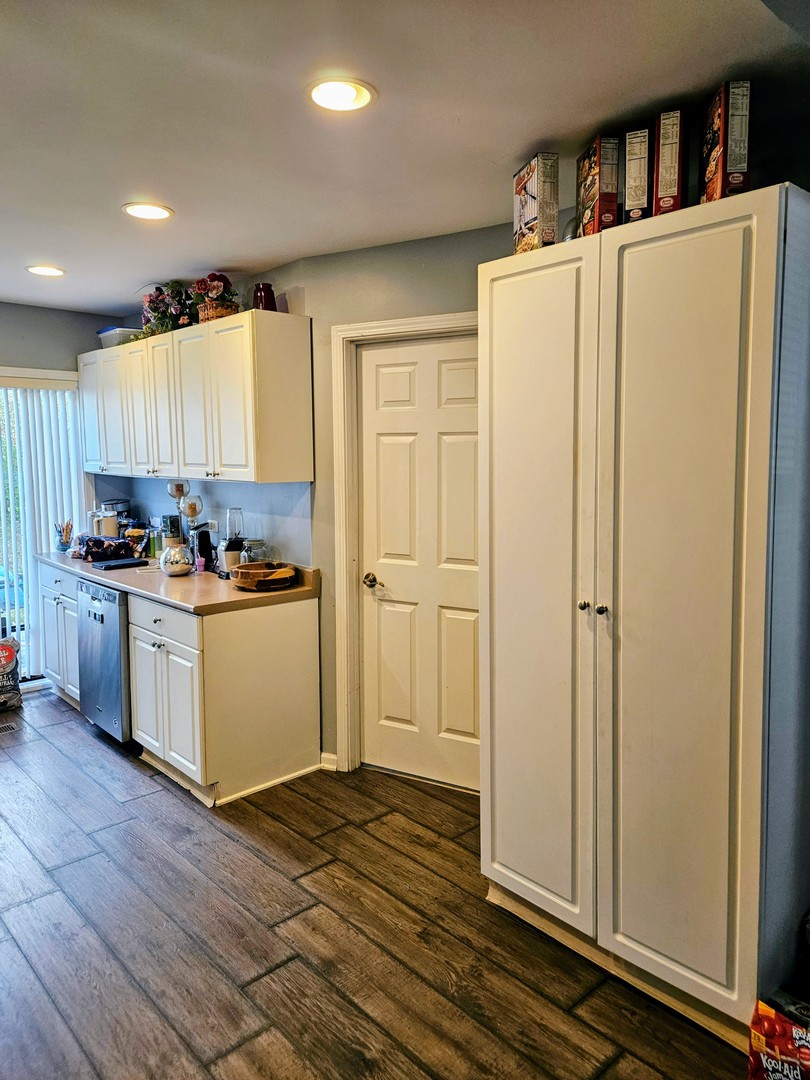 1213 West Main Street Ottawa, IL 61350 - Photo 5 of 11 a kitchen with refrigerator and cabinets