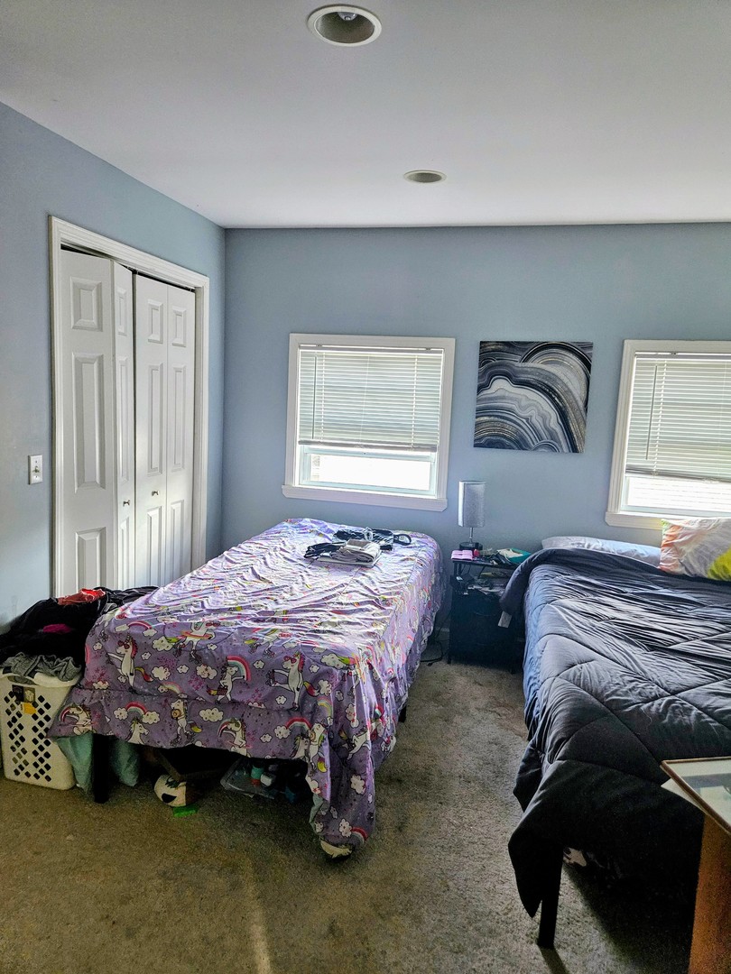 1213 West Main Street Ottawa, IL 61350 - Photo 9 of 11 a bedroom with bed and window