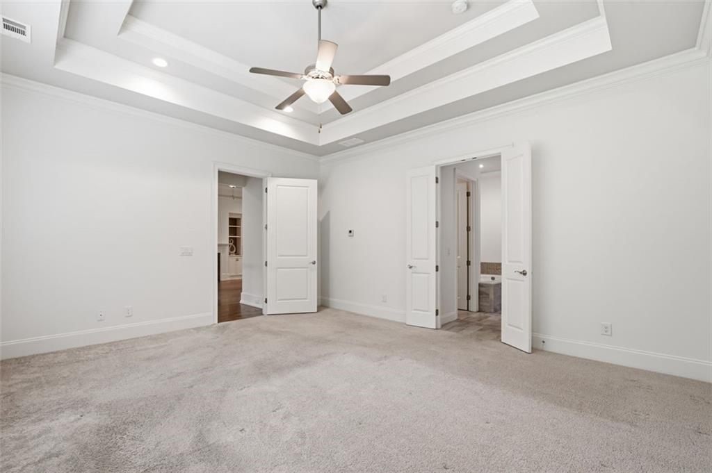 337 Rosshandler Road Suwanee, GA 30024 - Photo 22 of 45 an empty room with a ceiling fan and window