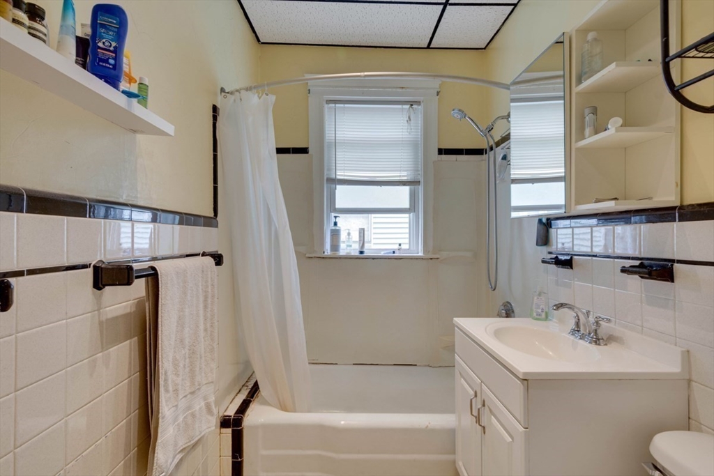 45 Jackson Road Somerville, MA 02145 - Photo 20 of 27 a bathroom with a sink a toilet and shower