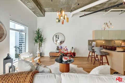 a living room with furniture and a table
