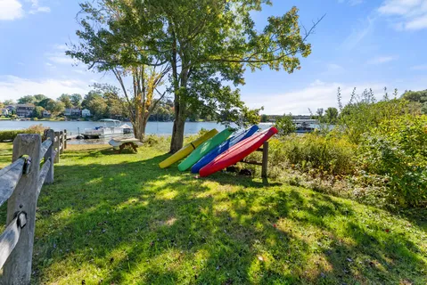 a backyard of a house with a yard and outdoor seating