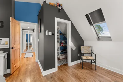 a bedroom with furniture and natural light