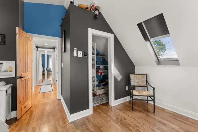 a bedroom with furniture and natural light