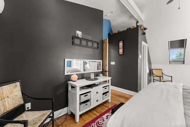 a bathroom with a sink a window and a mirror