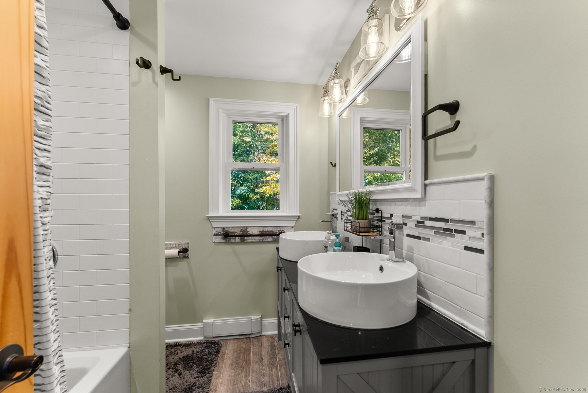 44 Bantam Lake Heights Morris, CT 06763 - Photo 26 of 40 a bathroom with a sink a window and a mirror