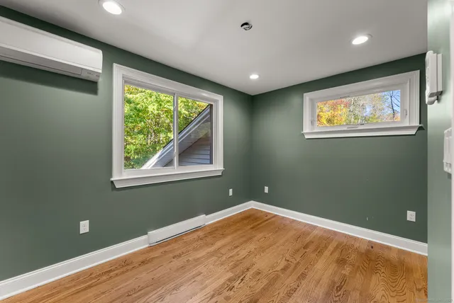 a view of entryway with wooden floor
