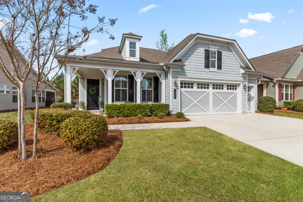 a front view of a house with a yard