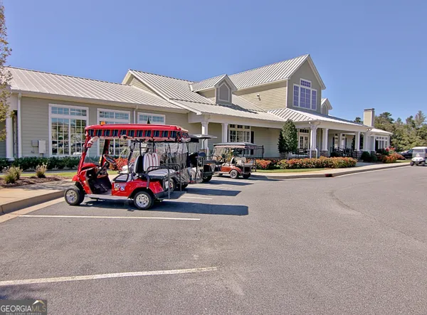 a view of a swimming pool with a yard