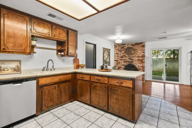 a spacious bathroom with a sink double vanity and a mirror
