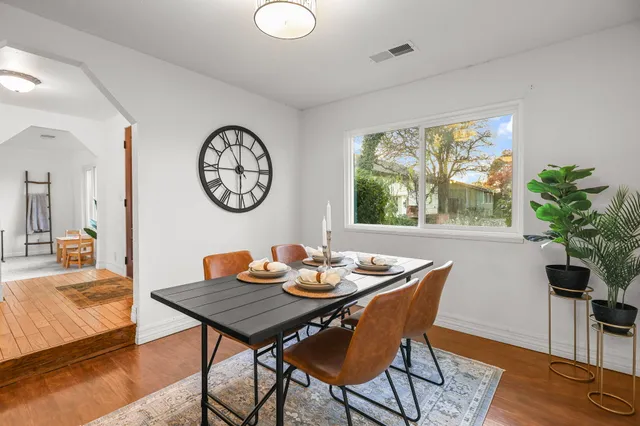a view of a dining room with furniture window and wooden floor
