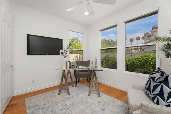 a view of a livingroom with furniture and a flat screen tv