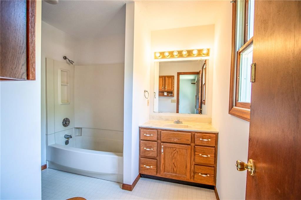 186 Riemer Road Sarver, PA 16055 - Photo 11 of 25 a bathroom with a tub a sink and a mirror