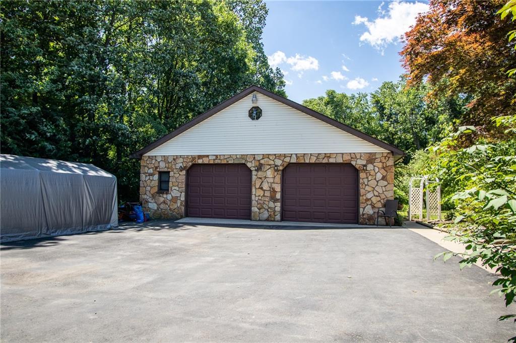 186 Riemer Road Sarver, PA 16055 - Photo 25 of 25 a front view of a house with a yard and garage