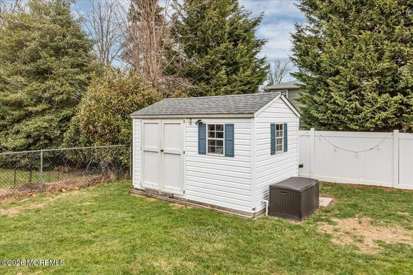 a front view of a house with a yard table and chairs