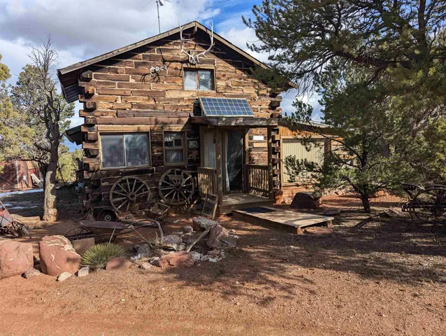 a view of a house with wooden fence