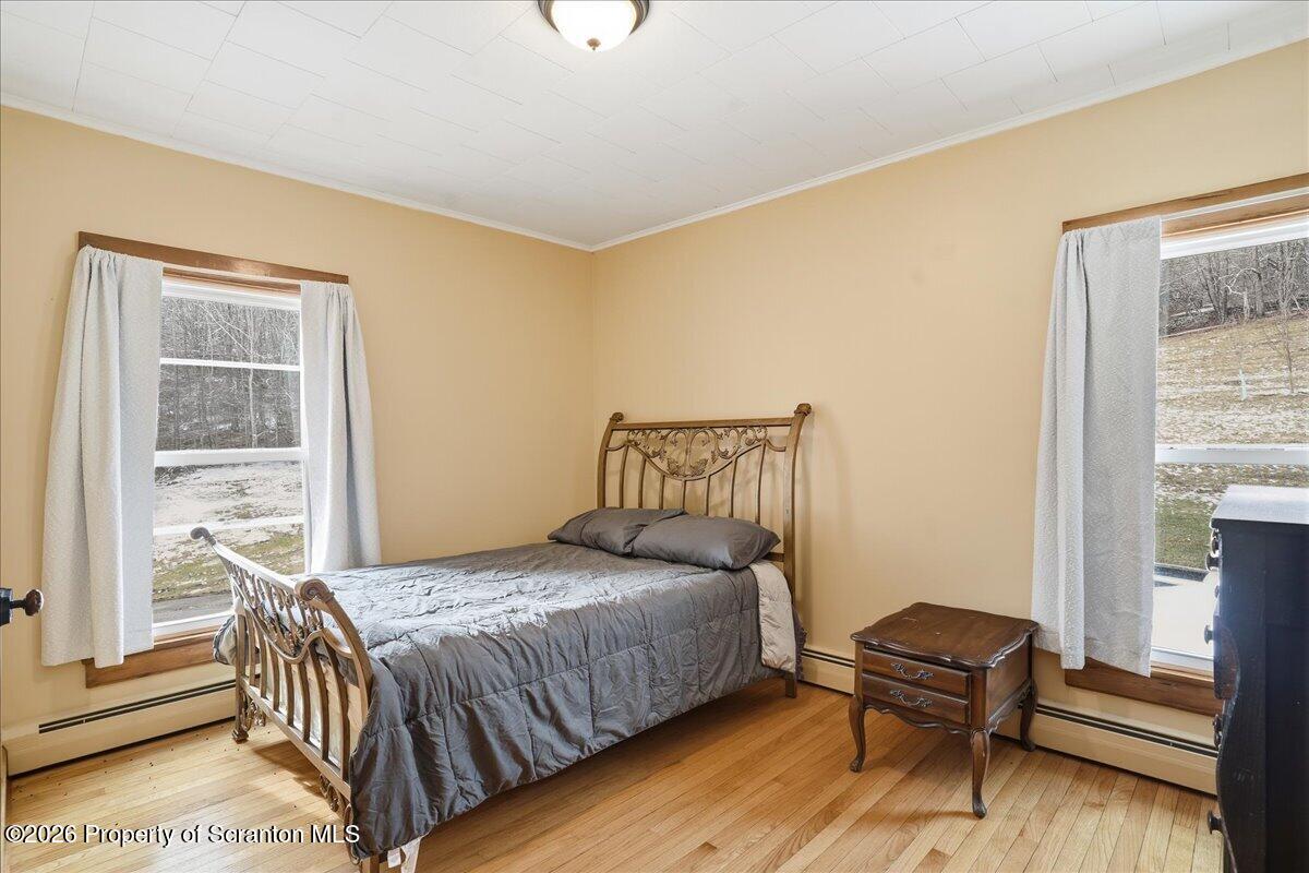 795 Wescott Road New Milford, PA 18834 - Photo 49 of 81 a bedroom with a bed and a window
