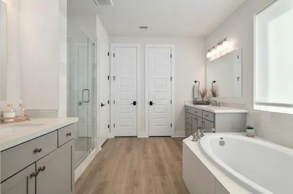 an empty room with closet and windows