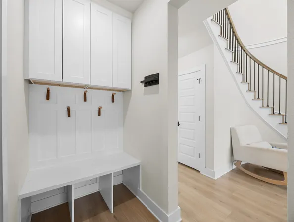 a view of an entryway with wooden floor