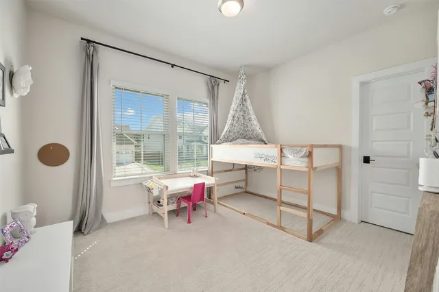 a living room with furniture and white walls