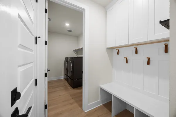 a view of entryway with wooden floor