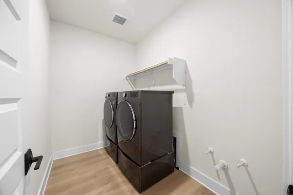 a view of kitchen with furniture and wooden floor