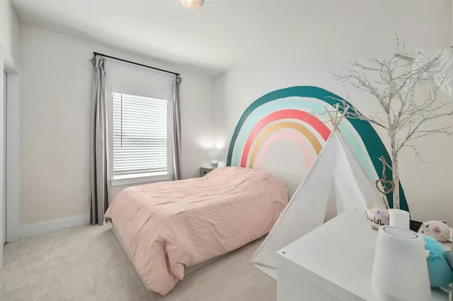 a bedroom with a bed and a sink