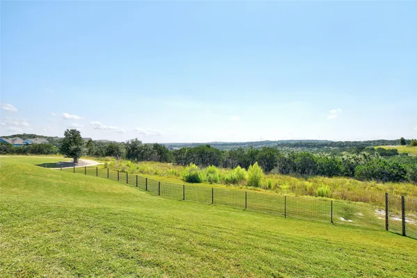 a view of living room kitchen and patio