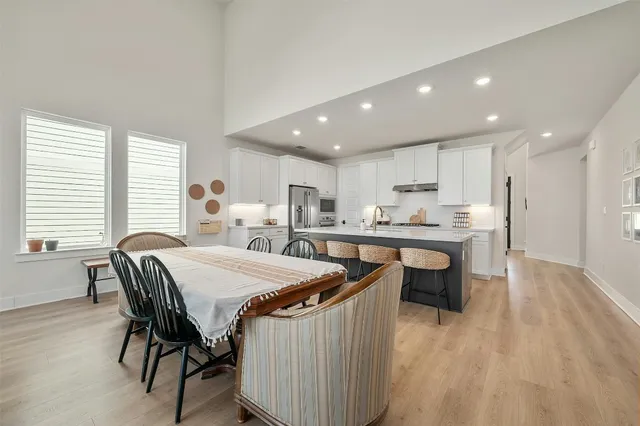 a very nice looking dining room with a table and chairs