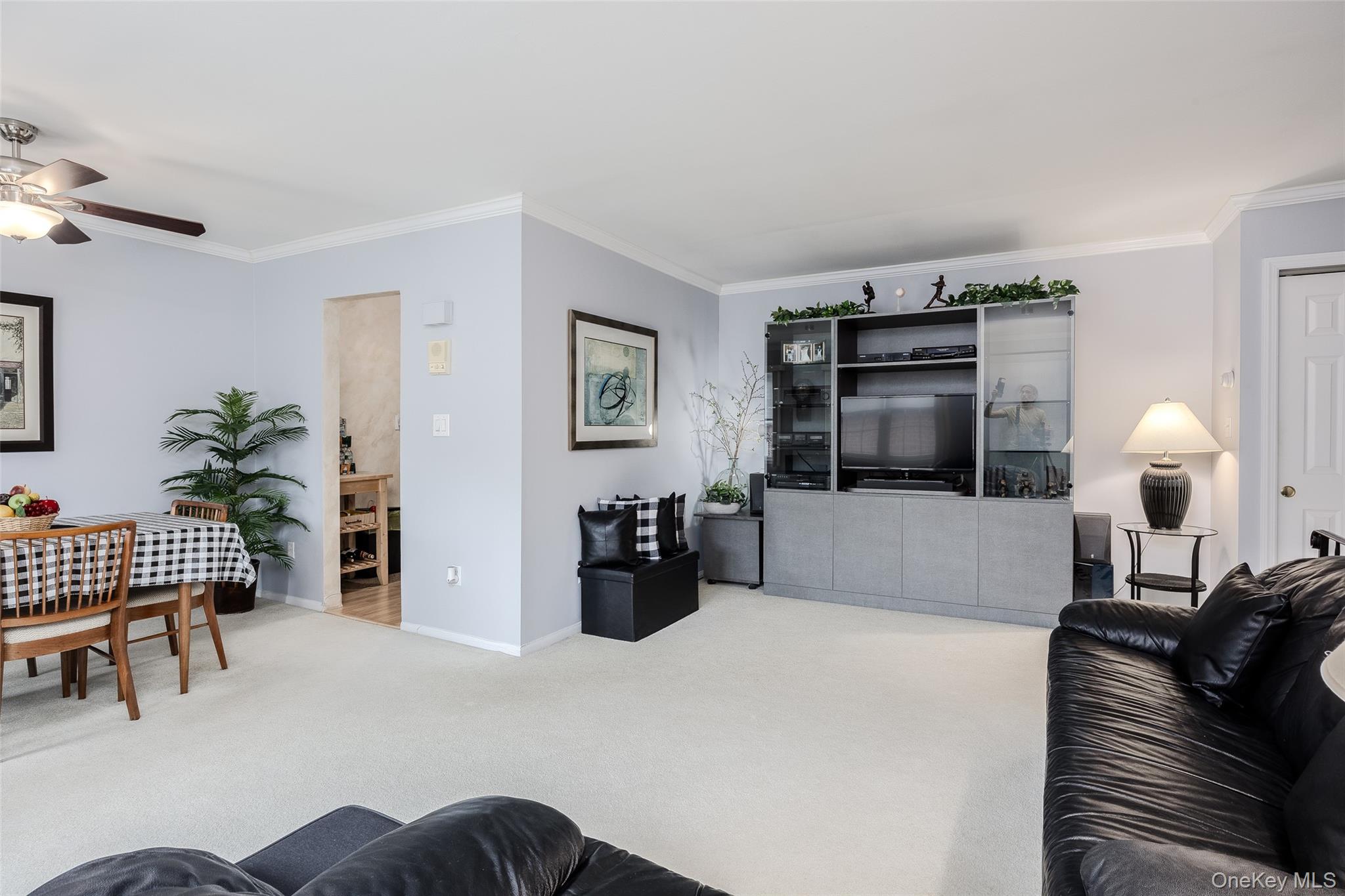 a bedroom with furniture and a lamp