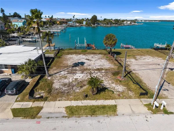 a view of a lake in front of residential houses