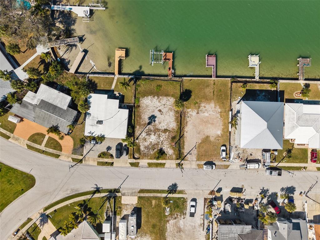 15307 Harbor Drive Madeira Beach, FL 33708 - Photo 11 of 26 an aerial view of multiple houses with outdoor space