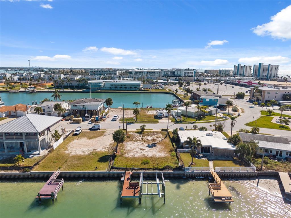 15307 Harbor Drive Madeira Beach, FL 33708 - Photo 7 of 26 an aerial view of a swimming pool with seating area