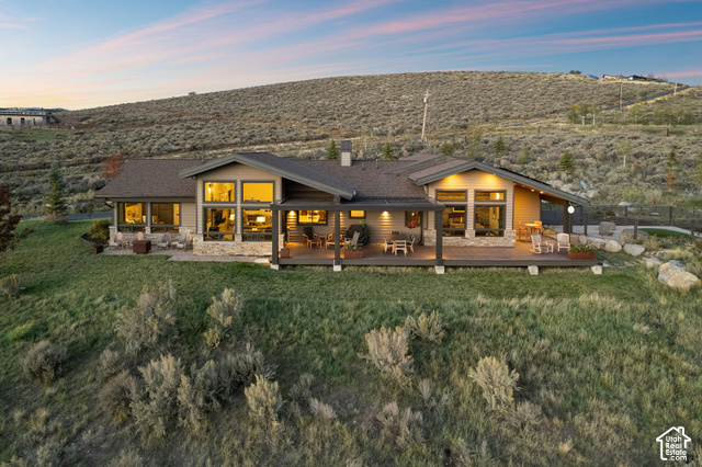 1130 Pace Road Park City, UT 84098 - Photo 6 of 73 Single-story residence featuring extensive decking, large windows, and stone accents