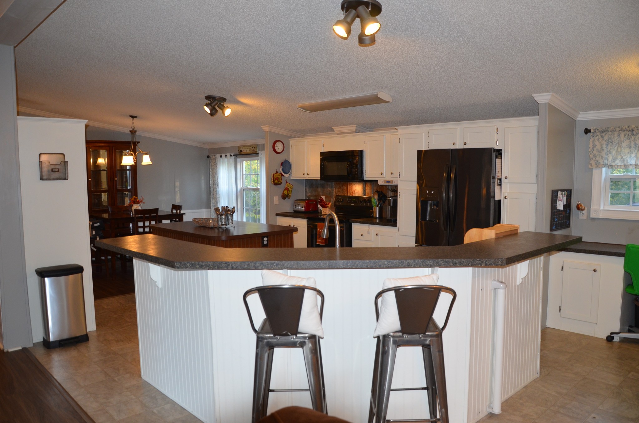 580 Speck Road Lebanon, TN 37087 - Photo 1 of 38 a kitchen with stainless steel appliances granite countertop a sink a microwave a refrigerator and chairs