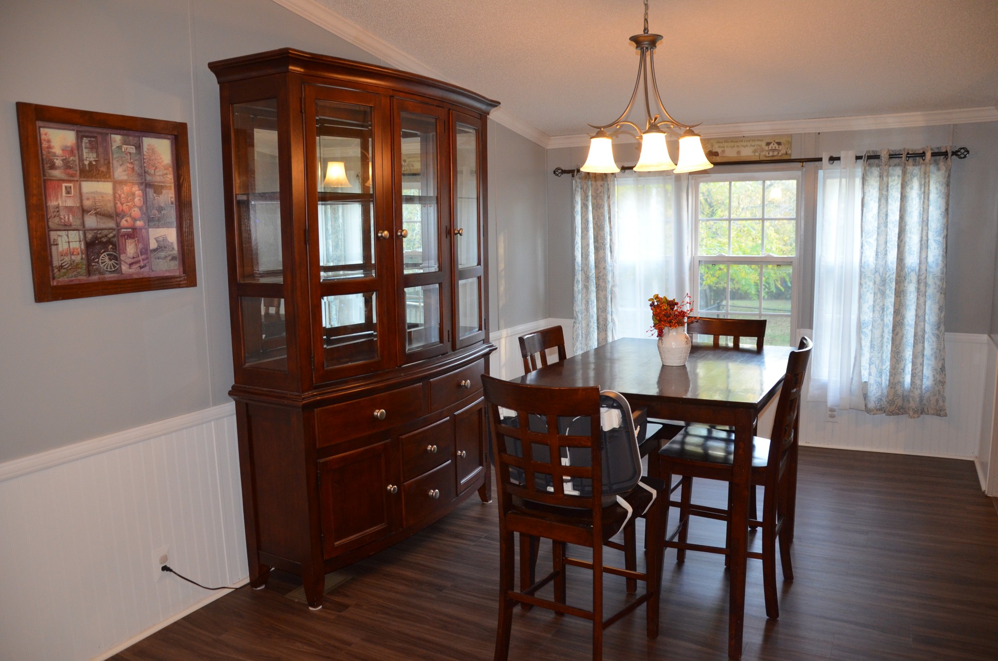 580 Speck Road Lebanon, TN 37087 - Photo 11 of 38 a dining room with wooden floor a chandelier a wooden table and chairs