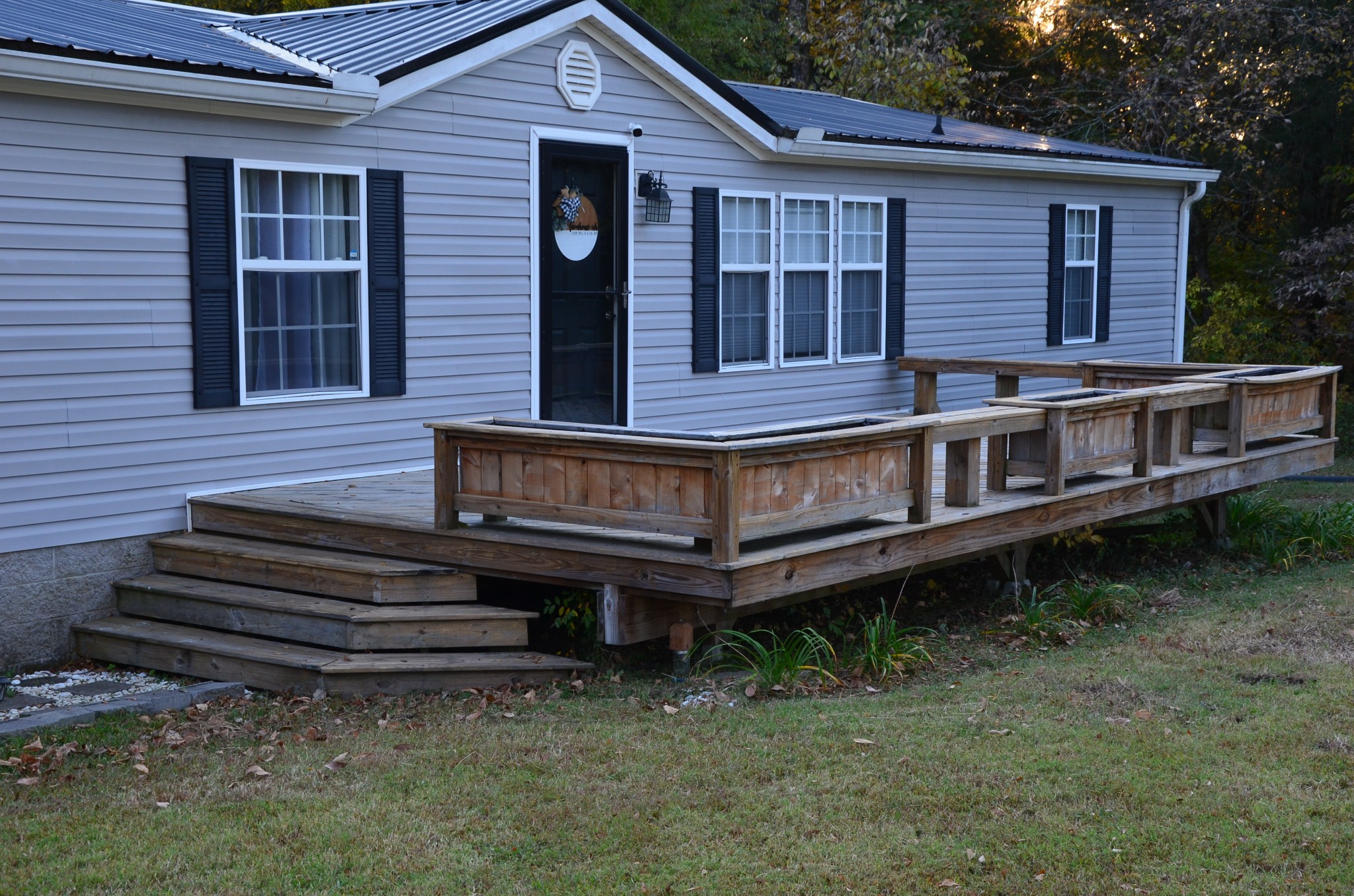 580 Speck Road Lebanon, TN 37087 - Photo 26 of 38 a view of a house with a yard and wooden deck