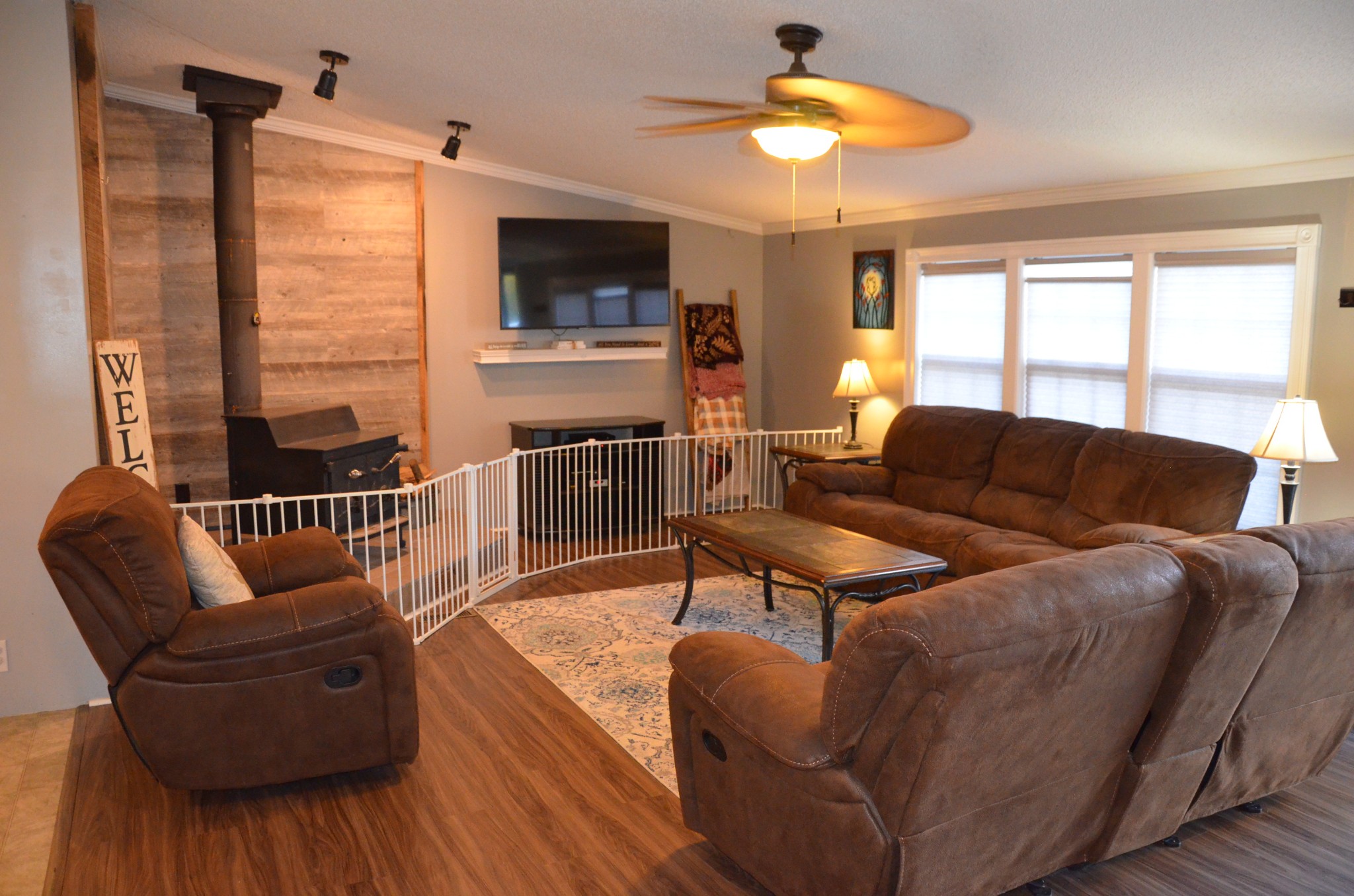 580 Speck Road Lebanon, TN 37087 - Photo 4 of 38 a living room with furniture a flat screen tv and a large window