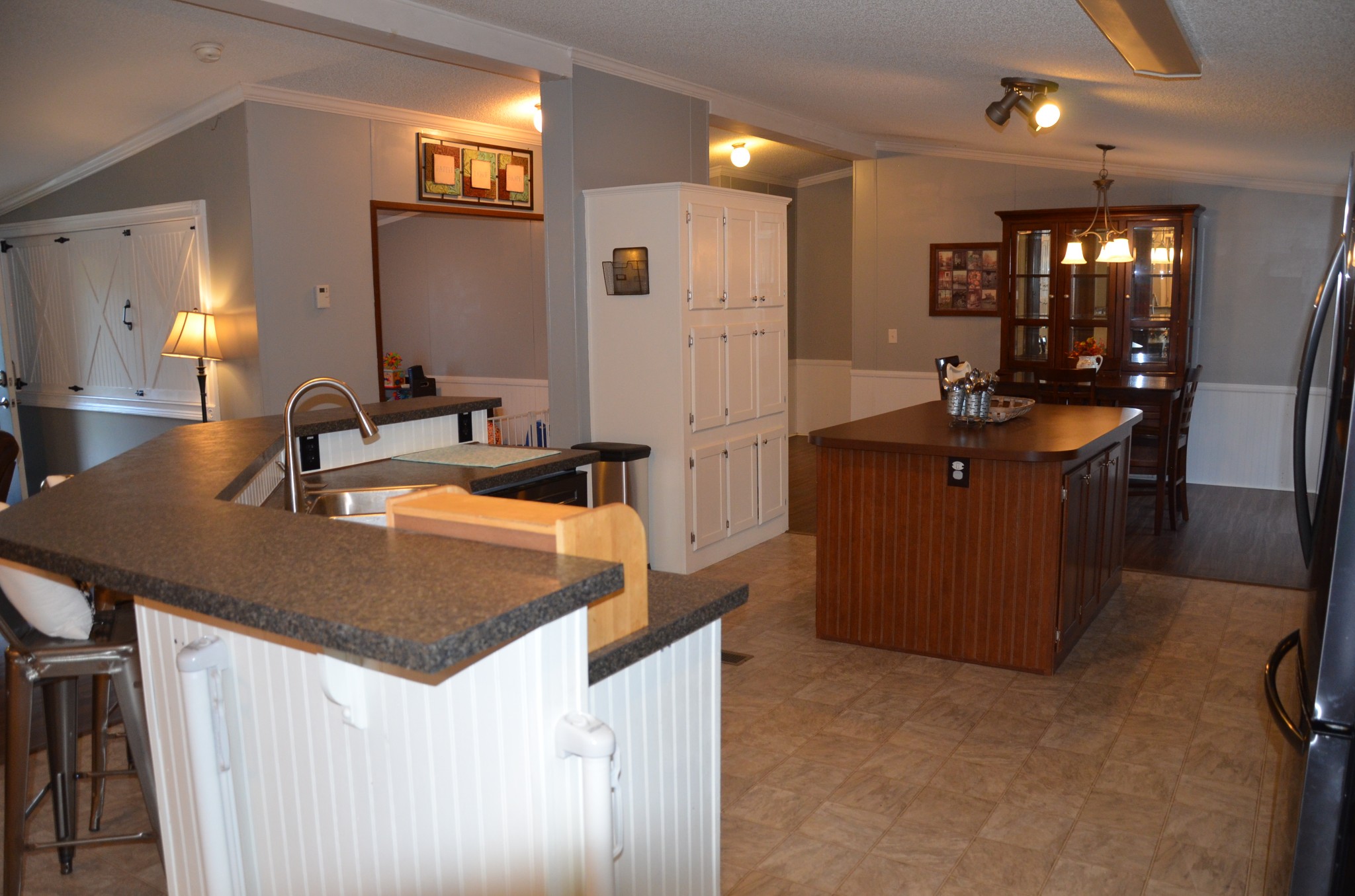580 Speck Road Lebanon, TN 37087 - Photo 6 of 38 a kitchen with kitchen island granite countertop a sink and refrigerator