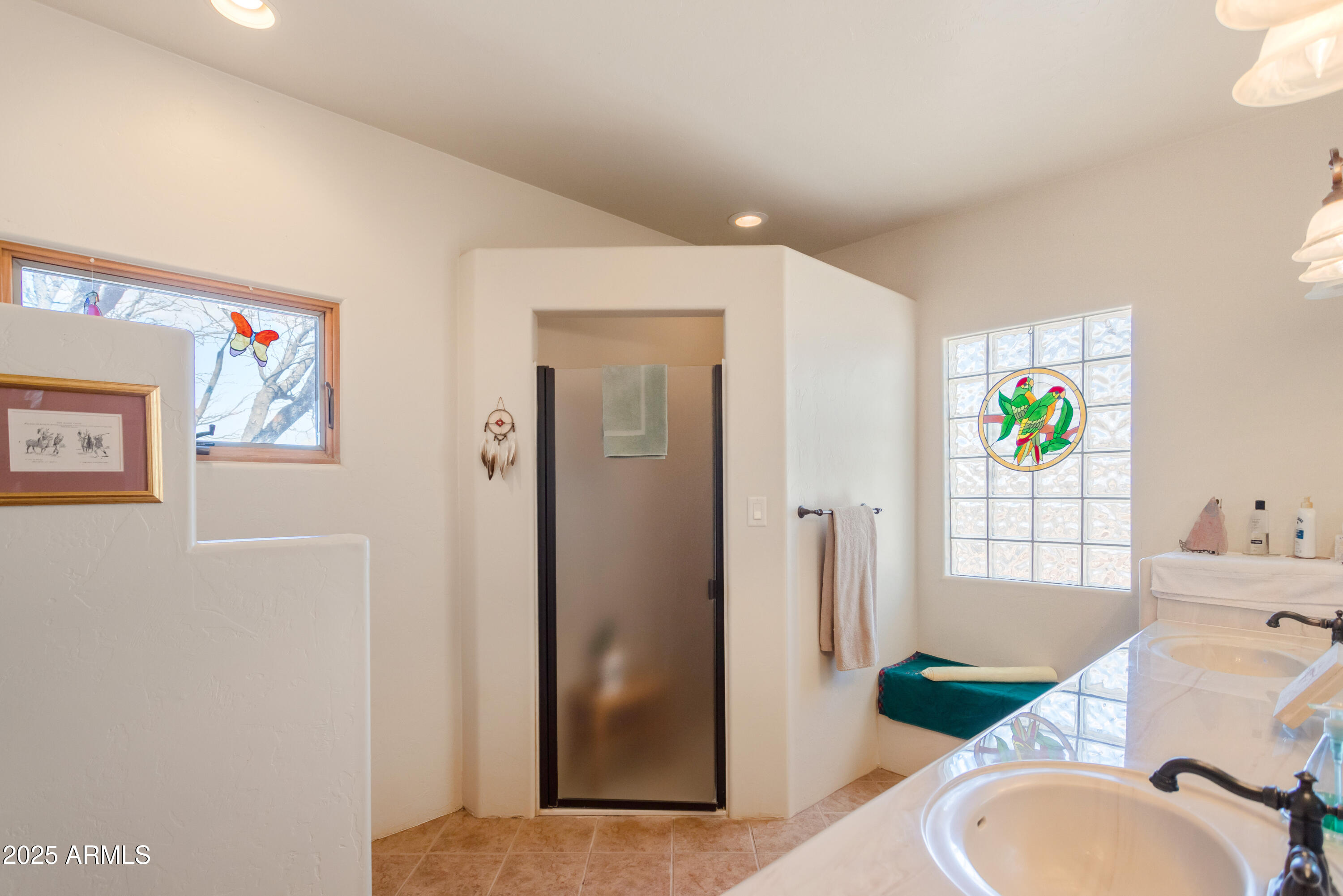 8765 South Airstrip Road Hereford, AZ 85615 - Photo 21 of 47 a bathroom with a granite countertop toilet sink and mirror