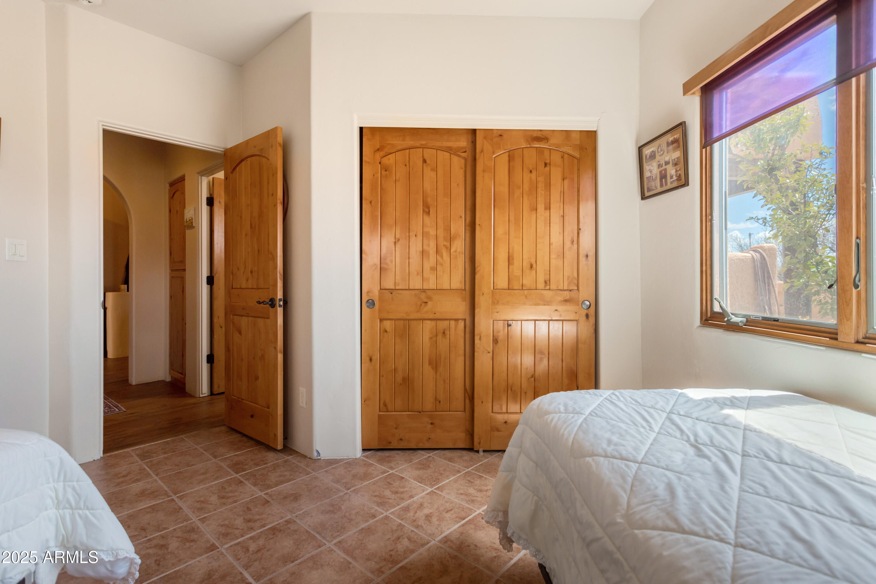8765 South Airstrip Road Hereford, AZ 85615 - Photo 23 of 47 a bedroom with a bed and a window