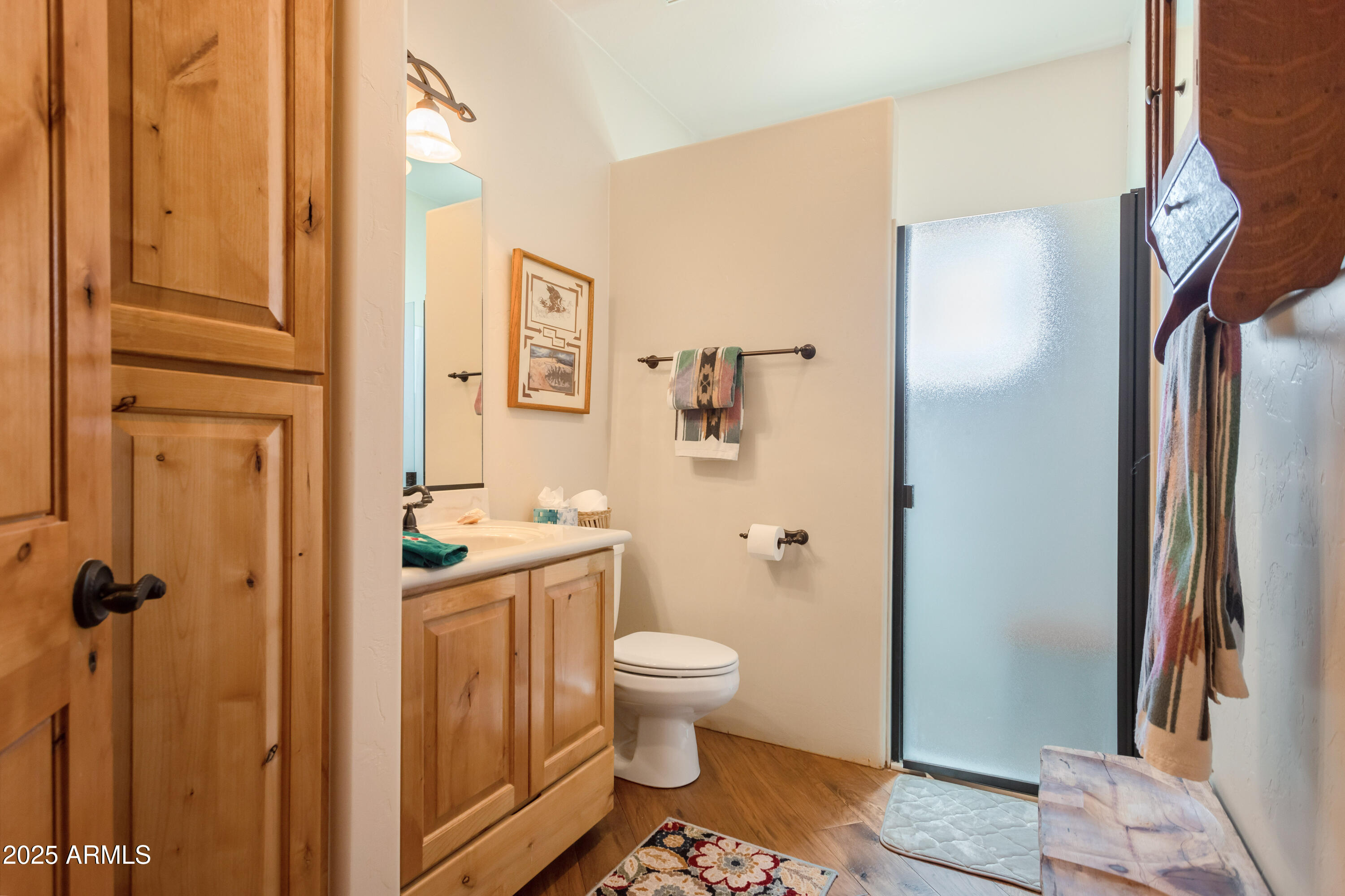 8765 South Airstrip Road Hereford, AZ 85615 - Photo 24 of 47 a bathroom with a sink a toilet and shower