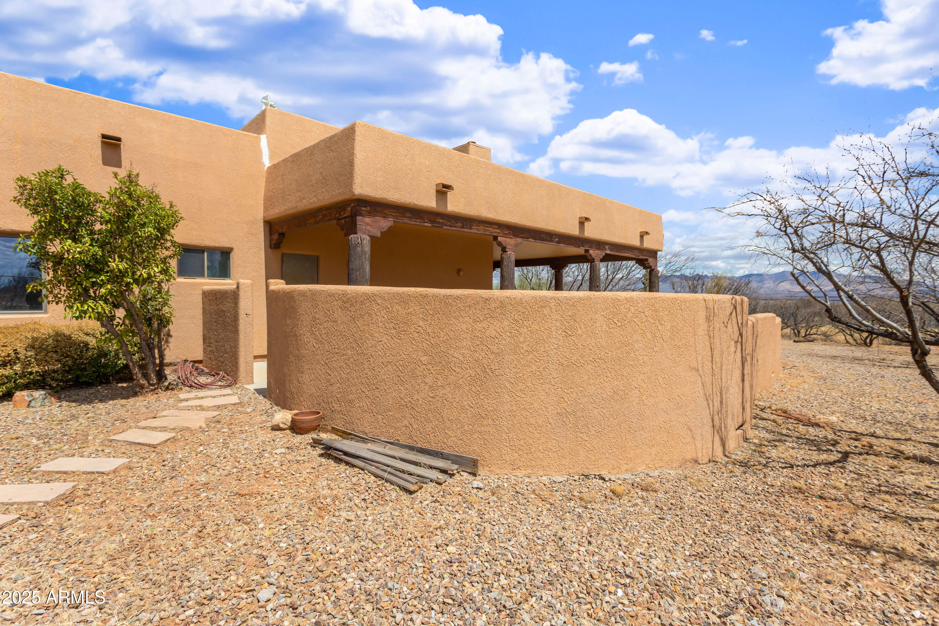 8765 South Airstrip Road Hereford, AZ 85615 - Photo 32 of 47 a front view of a house with a yard
