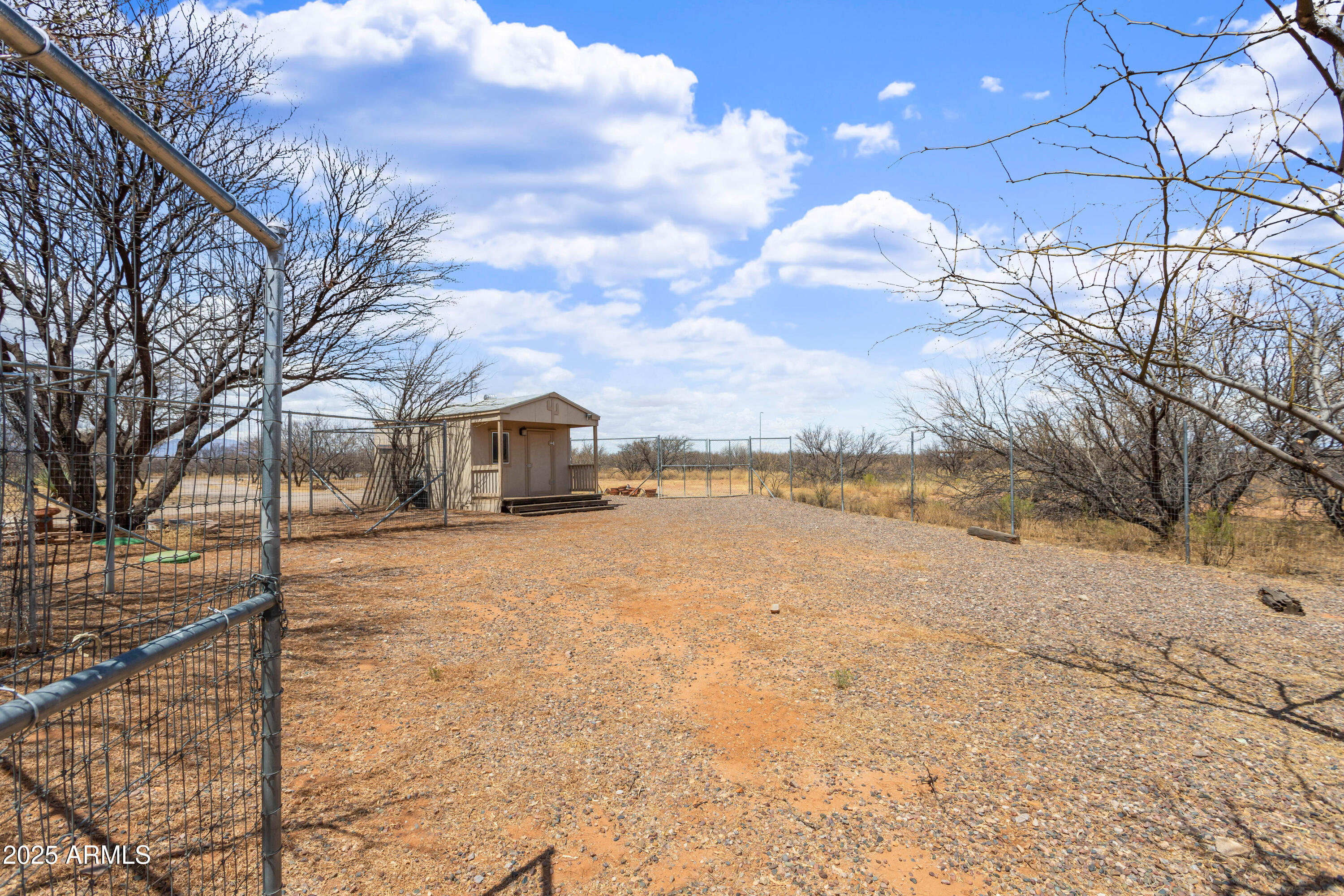 8765 South Airstrip Road Hereford, AZ 85615 - Photo 36 of 47 a street view with large trees